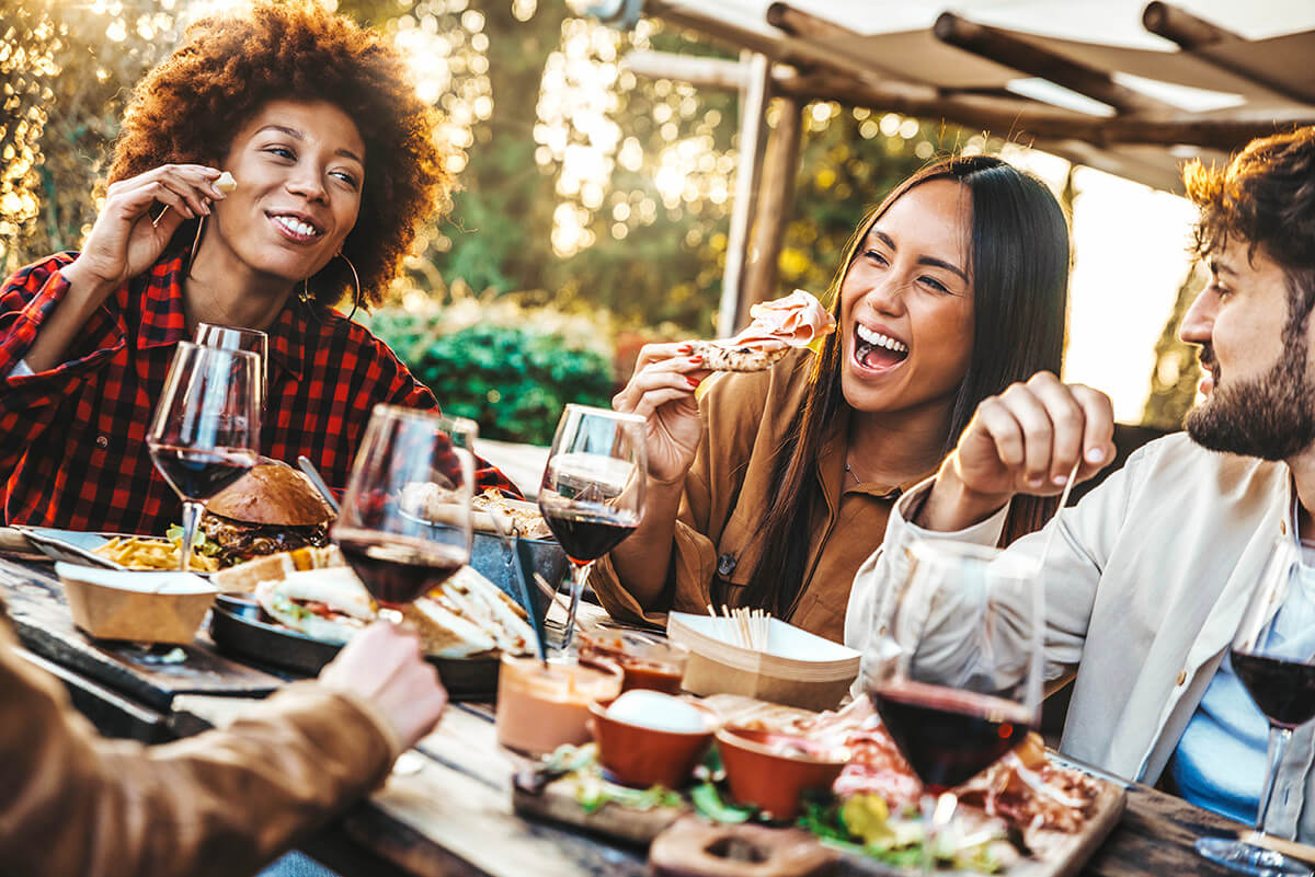 Friends having fun at barbecue dinner party